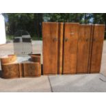 A Wrighton walnut three-piece bedroom suite with wardrobe, dressing table and compactum, the