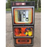 An 80s CD playing jukebox, the angled machine with glass window displaying menus, the case with