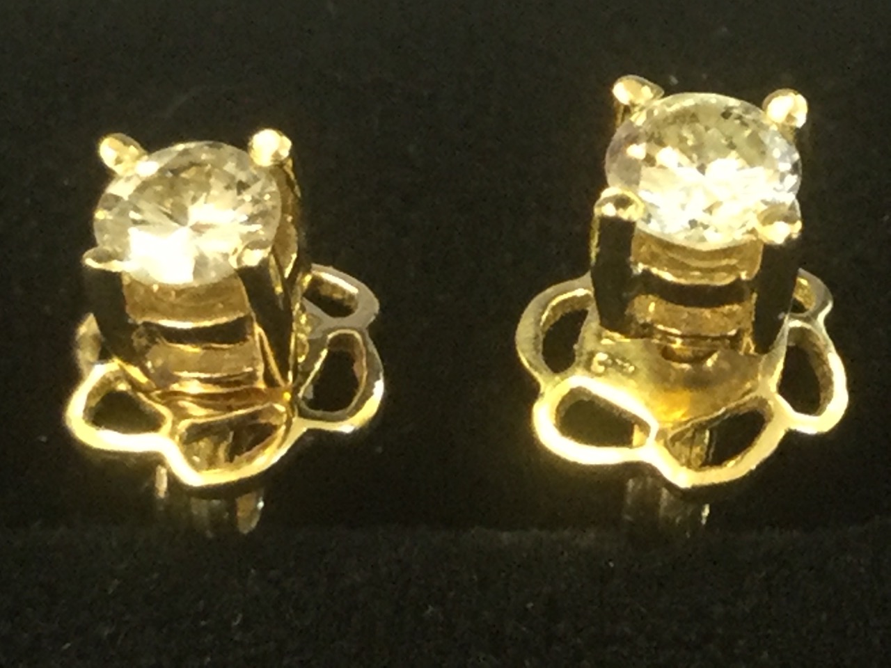 A pair of 18ct yellow gold diamond ear studs, the diamond claw set brilliant cut stones of 0.3