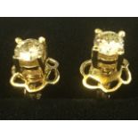 A pair of 18ct yellow gold diamond ear studs, the diamond claw set brilliant cut stones of 0.3