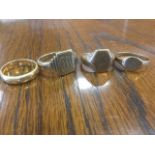 Three hallmarked gold gentlemans signet rings; and an 18ct gold wedding band. (4)