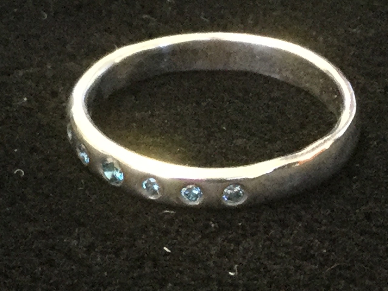 A platinum ring set with seven blue stones - untested. - Image 2 of 3