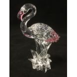 A Swarovski flamingo with pink beak & tail feathers, in presentation box with certificate - cost £