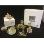 The Swarovski Crystal memories including a hot air balloon sitting on frosted base; a Viking ship