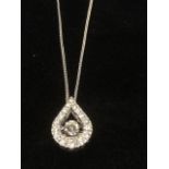 A white gold pear shaped diamond pendant, the pear shaped drop frame set with diamonds enclosing a
