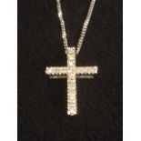 A 9ct white gold hallmarked diamond crucifix, the cross set with diamonds, mounted on a fine