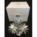 A Swarovski crystal spray of flowers, with presentation case and certificate - cost £265. (6in)