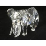 A Swarovski African elephant modelled with frosted tusks having black bead eyes, boxed with