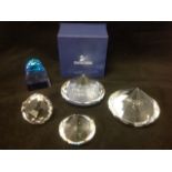 A collection of Swarovski paperweights - some boxed with certificates - cost over £200. (5)