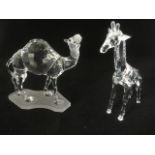 A Swarovski camel on frosted base with amber bead eyes; and a standing giraffe with frosted