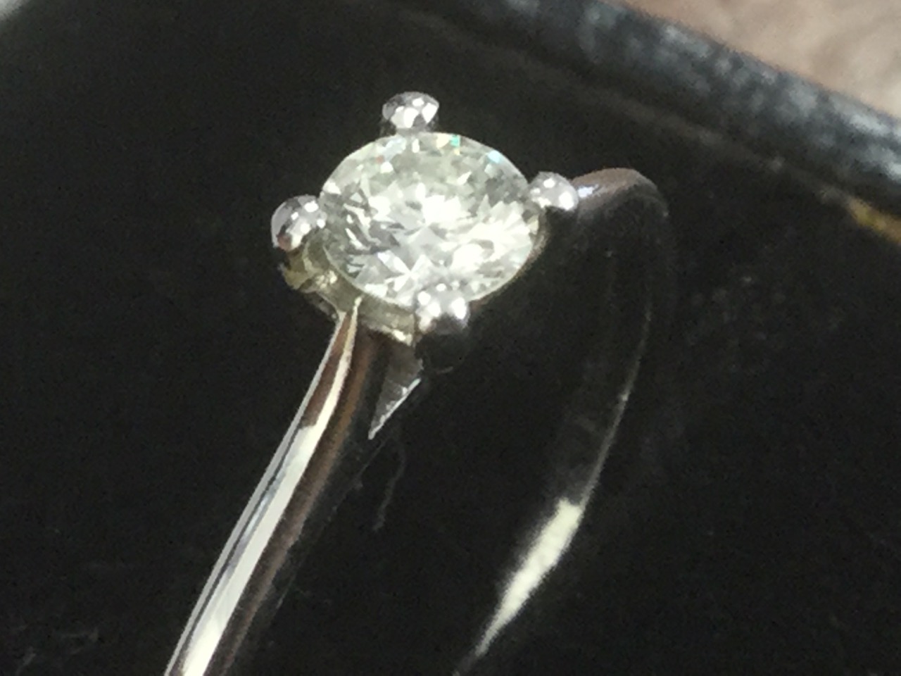A platinum diamond ring, the claw set circular stone of 0.20 carats, on tapering plain hallmarked - Image 2 of 3