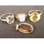 Two hallmarked gold rings claw set with large circular clear stones; a small 9ct gold signet ring