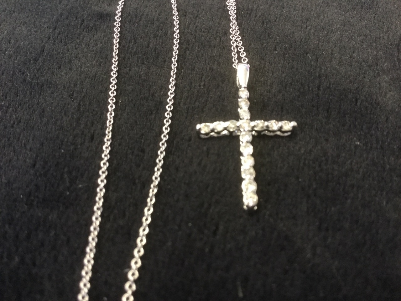 A platinum and diamond crucifix, the cross set with diamonds, mounted on a fine 18ct gold chain. ( - Image 3 of 3