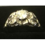 An 18ct white gold Victorian style diamond ring, the raised claw set diamond of under half a