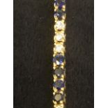 A 14ct gold sapphire & diamond tennis bracelet, the sapphire stones of over 3 carats and diamonds of