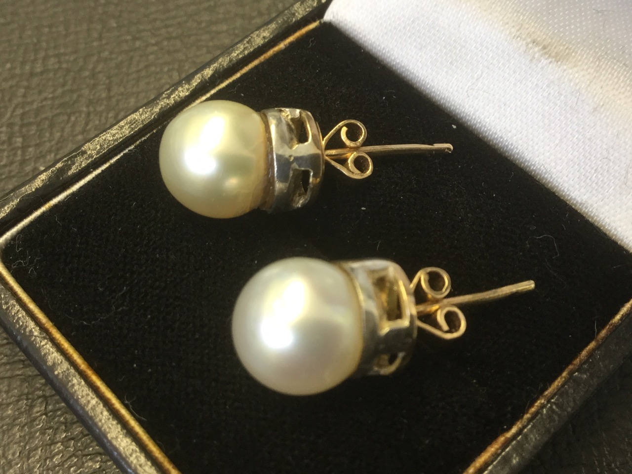 A pair of large quarter inch pearl earrings, the iridescent pearls on a pierced collar, with - Image 2 of 3