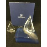 The Swarovski Legend large sailing boat, complete with glass display stand; and a smaller Legend