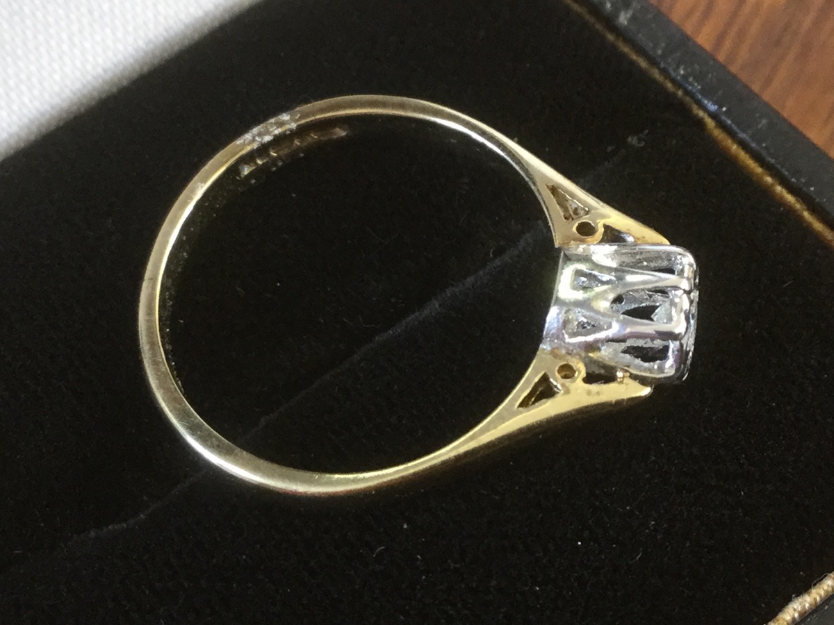 A 9ct gold diamond ring, the crown set brilliant cut circular stone raised in a white gold cage, - Image 2 of 3