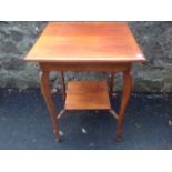 A square mahogany occasional table, raised on shaped sabre legs joined by platform stretcher.