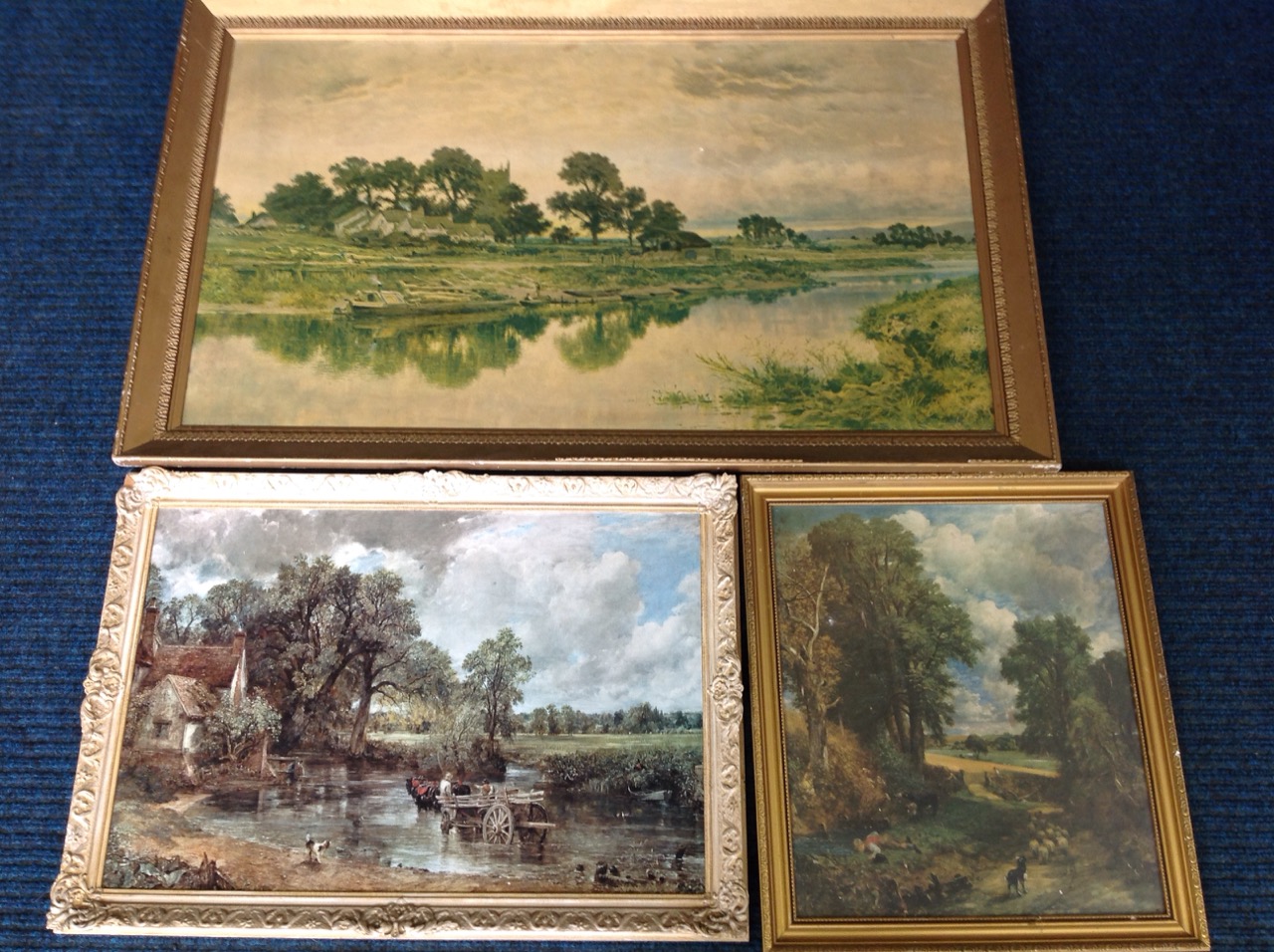 A large gilt framed landscape print after Leader titled Golden Hours; and two framed Constable