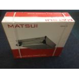 A boxed stainless steel Matsui cooker hood, with extractor fan, light, grease filter, etc.