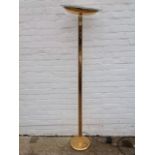 A brass uplighter, with elliptical inverted bowl shade on rectangular rounded column, above a