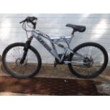 A boys SFX silver fox mountain bike with gears, soft seat, suspension, etc.