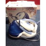 A boxed Tefal express steam generator iron.