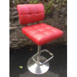 An Italian style leather upholstered high chair/stool, the revolving seat with footrest on an