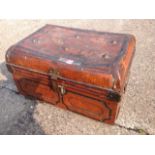 A Victorian metal tin trunk with studded hinged lid and carrying handles to ends.