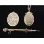 A ladies gilt metal retracing pencil, the hexagonal case with foliate decoration having agate knop -