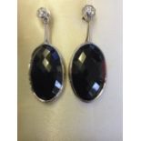 A pair of 18ct gold pear shaped rose cut natural black sapphire and diamond drop earrings, the bezel