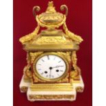 A Victorian ormolu & marble mantle clock, the architectural style case with swags surmounted by an