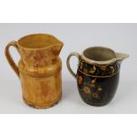 Late 18th / 19th century pearlware jug of baluster form, with brown glaze and yellow,