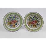 Two early 19th century pearlware plates, boldly painted with flowers,