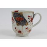 18th century Worcester coffee cup with painted Imari palette floral segmented panels and fluted