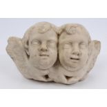 Antique carved carrera marble relief, with twin-winged cherub heads,