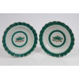 Pair 18th century Worcester green and gilt bordered plates with fluted borders and central floral