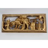 Chinese carved and pierced giltwood panel carved in high relief with elephant and precious objects,