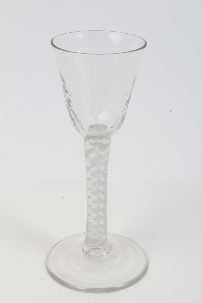 Georgian cordial glass with mottled rounded funnel bowl and double opaque twist stem on splayed