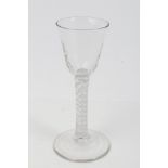 Georgian cordial glass with mottled rounded funnel bowl and double opaque twist stem on splayed