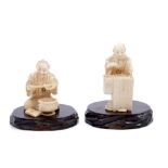 Pair of Japanese Meiji carved ivory netsukes depicting domestic figures at work,