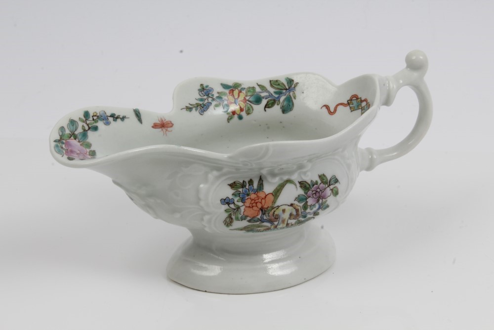 18th century Worcester porcelain pedestal sauce boat with moulded floral scrolls and cartouches and