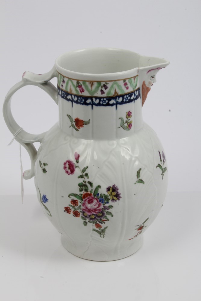 Large 18th century Worcester moulded cabbage leaf jug painted in the manner of Rogers,