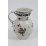 Large 18th century Worcester moulded cabbage leaf jug painted in the manner of Rogers,