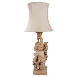 Rococo-style carved pine figural lamp base modelled as a standing putto with drapery and rising