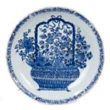 Early 18th century Chinese export blue and white porcelain charger painted with central basket of