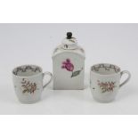 Pair 18th century Newhall-type coffee cans with polychrome painted floral sprigs and an 18th