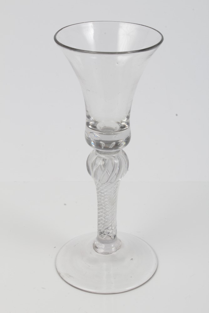 Georgian wine glass with bell-shaped bowl, with knopped air twist stem on splayed foot,