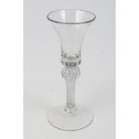 Georgian wine glass with bell-shaped bowl, with knopped air twist stem on splayed foot,